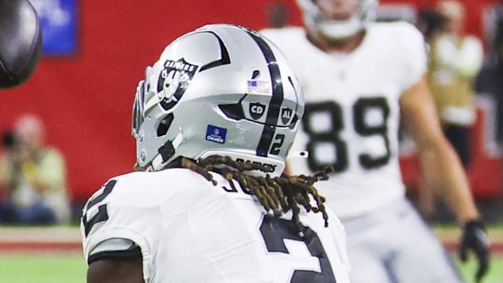 Dec 21, 2025; Houston, Texas, USA; Las Vegas Raiders running back Ashton Jeanty (2) catches a touchdown pass against the Houston Texans during the third quarter at NRG Stadium. Mandatory Credit: Thomas Shea-Imagn Images