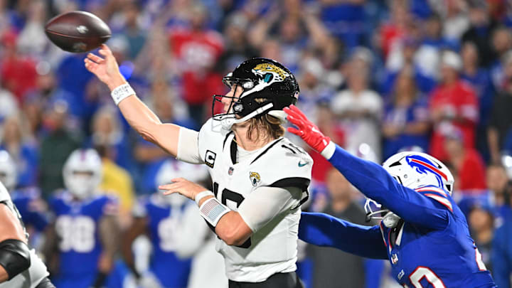 Sep 23, 2024; Orchard Park, New York, USA; Jacksonville Jaguars quarterback Trevor Lawrence (16) throws a pass under pressure by Buffalo Bills linebacker Von Miller (40) in the fourth quarter at Highmark Stadium. Mandatory Credit: Mark Konezny-Imagn Images