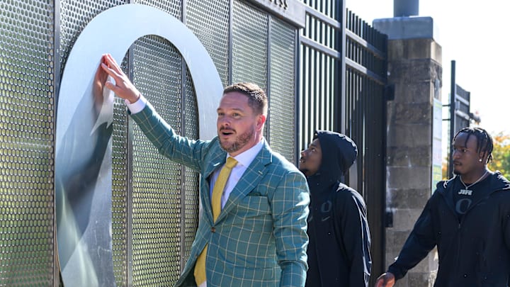 Oct 12, 2024; Eugene, Oregon, USA; Oregon Ducks head coach Dan Lanning touches the O during the walk in before the game against the Ohio State Buckeyes at Autzen Stadium. Mandatory Credit: Craig Strobeck-Imagn Images