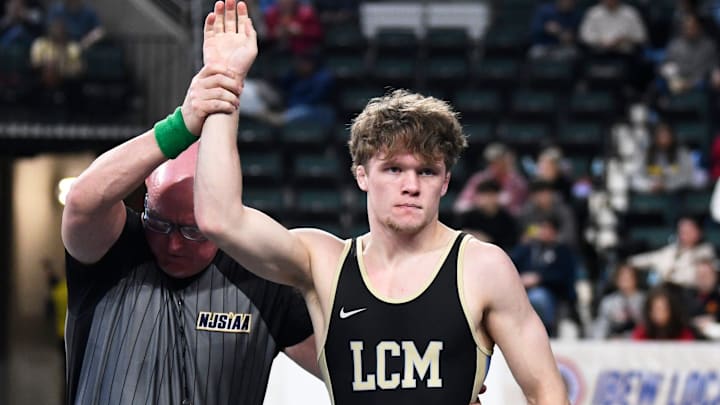 Lower Cape May's Chase Hansen has his arm raised after pinning Manasquan's Jaden Sanders during a 138-pound preliminary round bout of the 2026 NJSIAA Wrestling State Championships held at Boardwalk Hall in Atlantic City on Thursday, March 12, 2026.