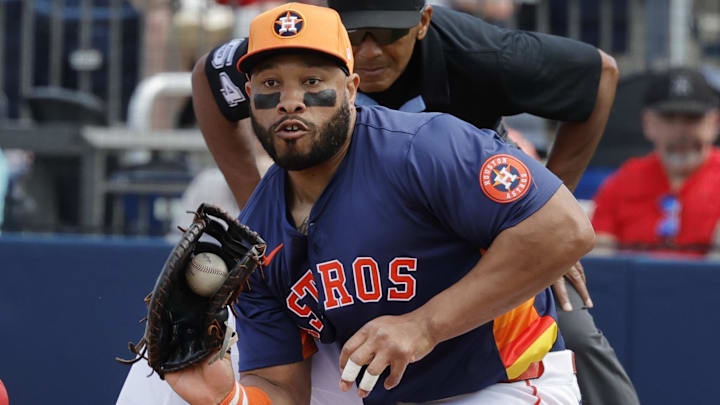 Washington Nationals outfielder Alex Call (17) dives into first base as Houston Astros first base Jon Singleton (28) fields the ball in the second inning at CACTI Park of the Palm Beaches.