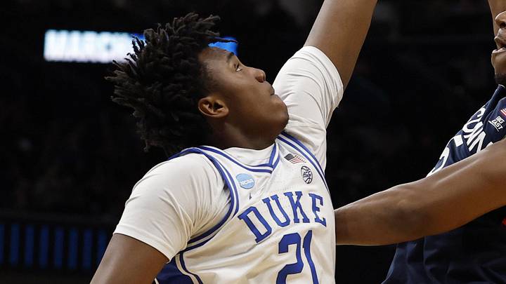 Mar 29, 2026; Washington, DC, USA; UConn Huskies forward Tarris Reed Jr. (5) shoots the ball over Duke Blue Devils center Patrick Ngongba (21) during an Elite Eight game of the East Regional of the men's 2026 NCAA Tournament at Capital One Arena. Mandatory Credit: Geoff Burke-Imagn Images