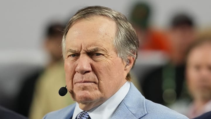 Jan 19, 2026; Miami Gardens, FL, USA; TV analyst Bill Belichick watches the Miami Hurricanes play the Indiana Hoosiers during the first half of the College Football Playoff National Championship game at Hard Rock Stadium. Mandatory Credit: Kirby Lee-Imagn Images