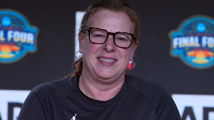 Apr 3, 2025; Tampa, FL, USA; UCLA Bruins coach Cori Close poses with the AP Coach of the Year trophy during press conference at Amalie Arena. Mandatory Credit: Kirby Lee-Imagn Images