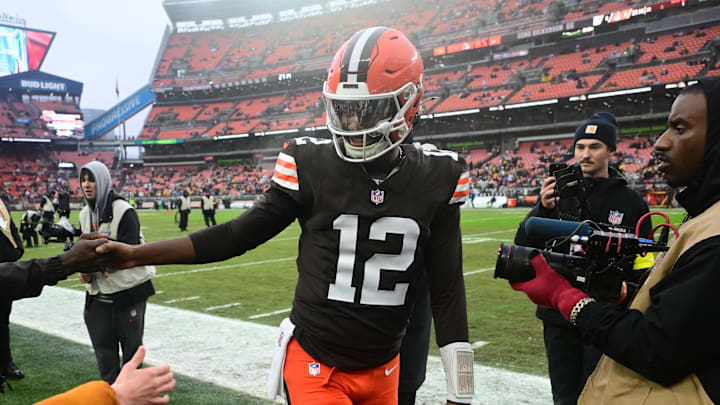 Dec 28, 2025; Cleveland, Ohio, USA; Cleveland Browns quarterback Shedeur Sanders (12) greets former NFL player Tony Brown before the game against the Pittsburgh Steelers at Huntington Bank Field. Mandatory Credit: Ken Blaze-Imagn Images