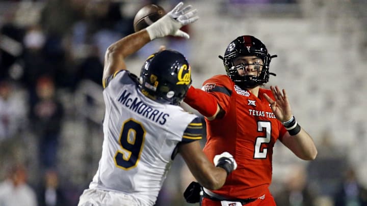 Patrick McMorris tries to break up a pass. Patrick McMorris tries to break up a pass.