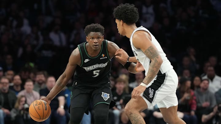 May 8, 2026; Minneapolis, Minnesota, USA; Minnesota Timberwolves guard Anthony Edwards (5) dribbles against the San Antonio Spurs guard Dylan Harper (2) in the second half during Game 3 of the second round of the 2026 NBA Playoffs at Target Center.