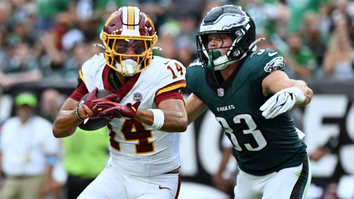 Sep 13, 2026; Philadelphia, Pennsylvania, USA;  Washington Commanders wide receiver Antonio Williams (14) carries the ball against Philadelphia Eagles defensive back Cooper DeJean (33) during the first half at Lincoln Financial Field.  Mandatory Credit: Eric Hartline-Imagn Images