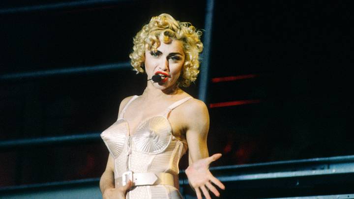 Madonna performs in her iconic conical bra corset during her 1990 Blond Ambition World Tour.