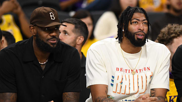 Oct 4, 2024; Palm Desert, California, USA; Los Angeles Lakers forward Anthony Davis (3), forward LeBron James (23) and forward Jarred Vanderbilt (2) on the sidelines against the Minnesota Timberwolves during the second half at Acrisure Arena. Mandatory Credit: Jonathan Hui-Imagn Images