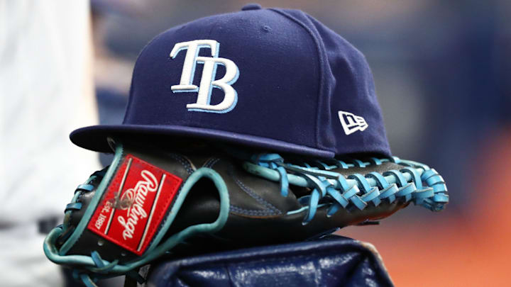 Sep 6, 2019; St. Petersburg, FL, USA; A detail view of a Tampa Bay Rays hat and glove at Tropicana Field.