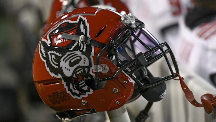 Nov 13, 2021; Winston-Salem, North Carolina, USA; A North Carolina State Wolfpack helmet seen on the sideline during the second half against the Wake Forest Demon Deacons at Truist Field. Mandatory Credit: William Howard-Imagn Images