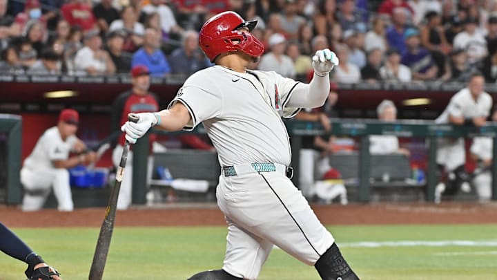 Jul 23, 2025; Phoenix, Arizona, USA; Arizona Diamondbacks first base Josh Naylor (22) hits an RBI single in the eighth inning against the Houston Astros at Chase Field. Jul 23, 2025; Phoenix, Arizona, USA; Arizona Diamondbacks first base Josh Naylor (22) hits an RBI single in the eighth inning against the Houston Astros at Chase Field.