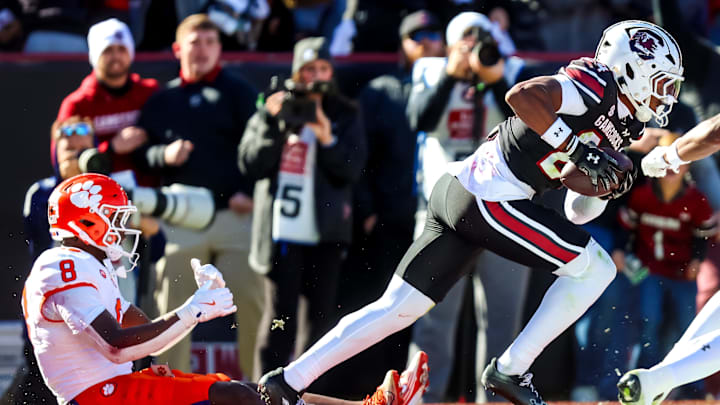 Nov 29, 2025; Columbia, South Carolina, USA; South Carolina Gamecocks defensive back Jalon Kilgore (24) celebrates after intercepting a pass intended for Clemson Tigers running back Adam Randall (8) in the first quarter at Williams-Brice Stadium. Mandatory Credit: Jeff Blake-Imagn Images