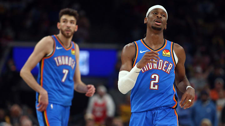 Apr 24, 2025; Memphis, Tennessee, USA; Oklahoma City Thunder guard Shai Gilgeous-Alexander (2) and forward Chet Holmgren (7) look on during the second quarter against the Memphis Grizzlies during game three for the first round of the 2024 NBA Playoffs at FedExForum. Mandatory Credit: Petre Thomas-Imagn Images