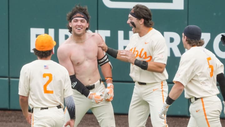 Tennessee players Ariel Antigua (2), Andrew Fischer (11), and Cannon Peebles (5) surround Chris Newstrom (10) in celebration after the win against Auburn in an NCAA baseball game on May 4, 2025, in Knoxville, Tenn. Tennessee players Ariel Antigua (2), Andrew Fischer (11), and Cannon Peebles (5) surround Chris Newstrom (10) in celebration after the win against Auburn in an NCAA baseball game on May 4, 2025, in Knoxville, Tenn.