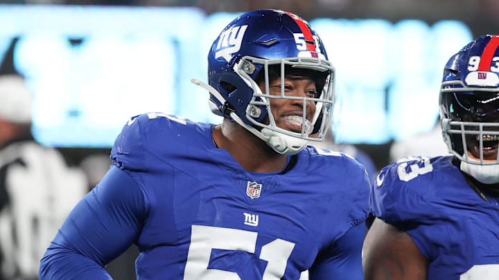 Jan 7, 2024; East Rutherford, New Jersey, USA; New York Giants linebacker Azeez Ojulari (51) celebrates with defensive tackle Rakeem Nunez-Roches (93) after recovering a fumble during the second half against the Philadelphia Eagles at MetLife Stadium. Mandatory Credit: Vincent Carchietta-Imagn Images
