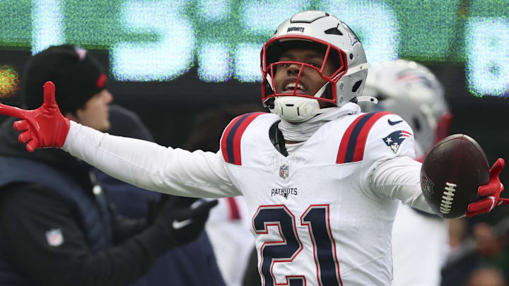 Dec 28, 2025; East Rutherford, New Jersey, USA; New England Patriots safety Jaylinn Hawkins (21) celebrates an interception against the New York Jets during the first quarter of the game at MetLife Stadium. Mandatory Credit: Vincent Carchietta-Imagn Images