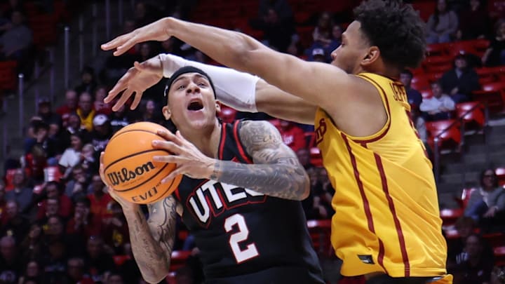 Feb 24, 2026; Salt Lake City, Utah, USA; Utah Utes guard Terrence Brown (2) drives against Iowa State Cyclones forward Joshua Jefferson (5) during the second half at Jon M. Huntsman Center.