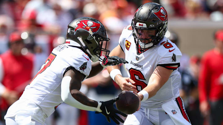Sep 22, 2024; Tampa, Florida, USA; Tampa Bay Buccaneers quarterback Baker Mayfield (6) hands off to running back Bucky Irving (7) against the Denver Broncos in the second quarter at Raymond James Stadium. Mandatory Credit: Nathan Ray Seebeck-Imagn Images Sep 22, 2024; Tampa, Florida, USA; Tampa Bay Buccaneers quarterback Baker Mayfield (6) hands off to running back Bucky Irving (7) against the Denver Broncos in the second quarter at Raymond James Stadium. Mandatory Credit: Nathan Ray Seebeck-Imagn Images