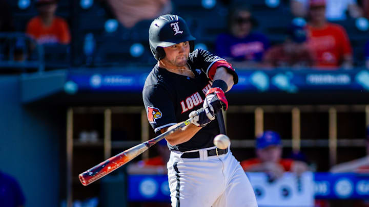 May 24, 2024; Charlotte, NC, USA; Louisville Cardinals catcher Luke Napleton (35) swings in the seventh inning against the Clemson Tigers during the ACC Baseball Tournament at Truist Field.