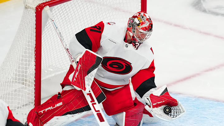 Oct 20, 2025; Las Vegas, Nevada, USA; Carolina Hurricanes goaltender Frederik Andersen (31) makes a glove save against the Vegas Golden Knights during the second period at T-Mobile Arena. Mandatory Credit: Stephen R. Sylvanie-Imagn Images