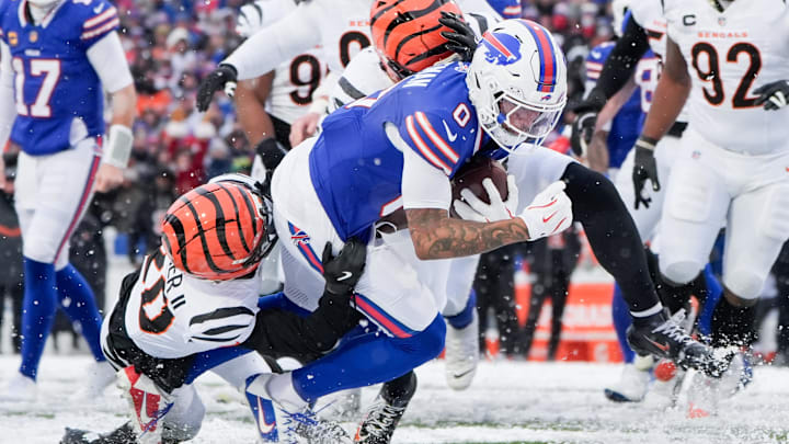 Dec 7, 2025; Orchard Park, New York, USA; Buffalo Bills wide receiver Keon Coleman (0) dives after a catch in the third quarter against the Cincinnati Bengals at Highmark Stadium.
