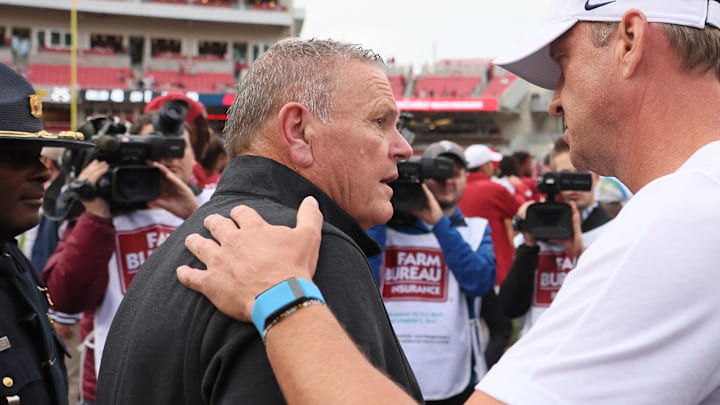 Arkansas Razorbacks coach Sam Pittman shakes hands with Ole Miss Rebels coach Lane Kiffin after the game at Razorback Stadium. Mississippi won 63-31.