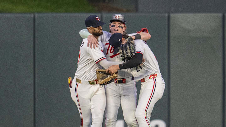 Jul 9, 2025; Minneapolis, Minnesota, USA; Minnesota Twins left fielder Willi Castro (50), center fielder Harrison Bader (12), and right fielder DaShawn Keirsey Jr. (21) celebrate after defeating the Chicago Cubs at Target Field. Mandatory Credit: Jesse Johnson-Imagn Images