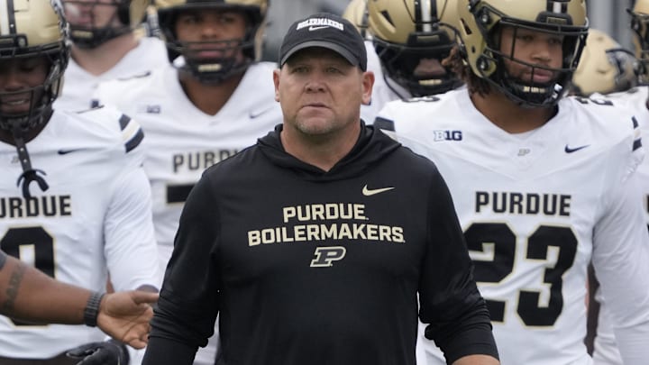 Purdue Boilermakers head coach Barry Odom takes the field