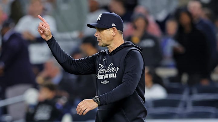 Oct 8, 2025; Bronx, New York, USA; New York Yankees manager Aaron Boone signals to the bullpen during the seventh inning against the Toronto Blue Jays during game four of the ALDS round for the 2025 MLB playoffs at Yankee Stadium. Mandatory Credit: Brad Penner-Imagn Images