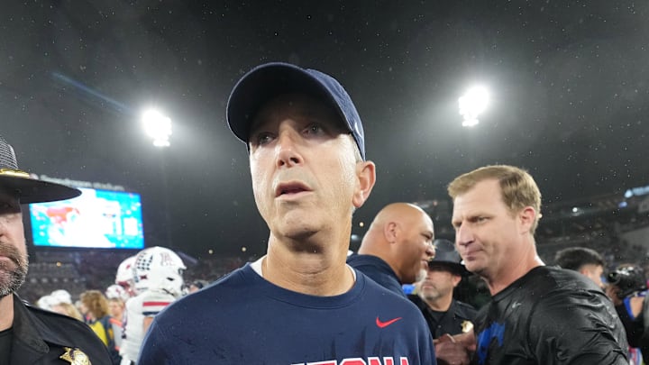 Jan 2, 2026; San Diego, CA, USA; Arizona Wildcats head coach Brent Brennan reacts after shaking hands with SMU Mustangs head coach Rhett Lashlee in the Holiday Bowl at Snapdragon Stadium. Mandatory Credit: Kirby Lee-Imagn Images