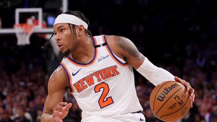 New York Knicks guard Miles McBride controls the ball against Indiana Pacers guard Bennedict Mathurin.