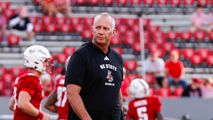 Aug 28, 2025; Raleigh, North Carolina, USA; North Carolina State Wolfpack head coach Dave Doeren walks among his players during the warmups prior to the game against East Carolina Pirates at Carter-Finley Stadium. Mandatory Credit: Jaylynn Nash-Imagn Images Aug 28, 2025; Raleigh, North Carolina, USA; North Carolina State Wolfpack head coach Dave Doeren walks among his players during the warmups prior to the game against East Carolina Pirates at Carter-Finley Stadium. Mandatory Credit: Jaylynn Nash-Imagn Images