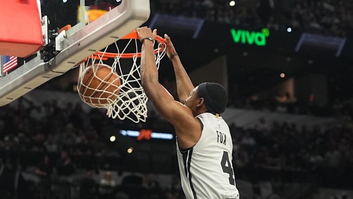Apr 8, 2026; San Antonio, Texas, USA; San Antonio Spurs guard De’Aaron Fox (4) dunks over Portland Trail Blazers forward Toumani Camara (33) during the first half at Frost Bank Center. Mandatory Credit: Scott Wachter-Imagn Images Apr 8, 2026; San Antonio, Texas, USA; San Antonio Spurs guard De’Aaron Fox (4) dunks over Portland Trail Blazers forward Toumani Camara (33) during the first half at Frost Bank Center. Mandatory Credit: Scott Wachter-Imagn Images