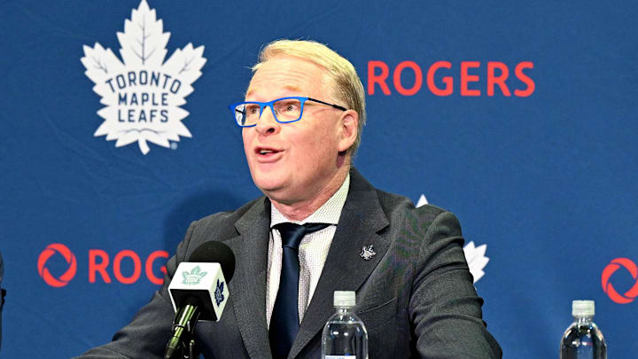 May 4, 2026; Toronto, Ontario, CANADA;  Maple Leafs Sports and Entertainment CEO Keith Pelley answers media questions between Toronto Maple Leafs general manager John Chayka (left) and senior executive advisor Mats Sundin during an introductory news conference at Real Sports Bar and Grill. Mandatory Credit: Dan Hamilton-Imagn Images
