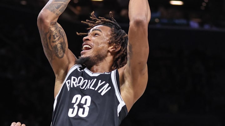 Feb 24, 2026; Brooklyn, New York, USA;  Brooklyn Nets center Nic Claxton (33) looks to drive past Dallas Mavericks forward Marvin Bagley III (35) in the first quarter at Barclays Center. Mandatory Credit: Wendell Cruz-Imagn Images
