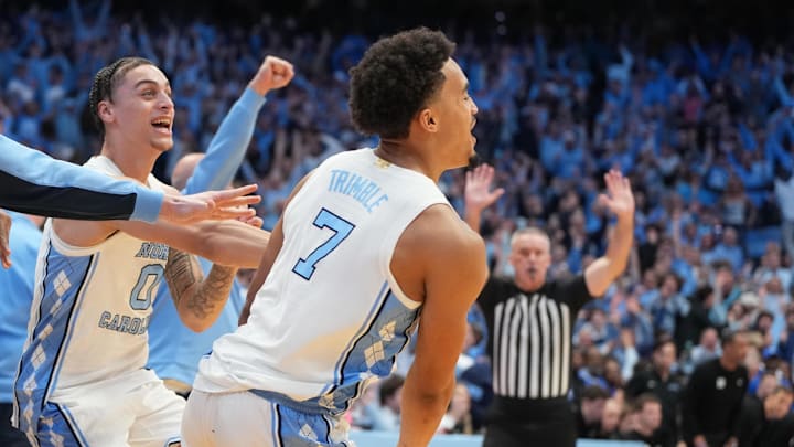 Feb 7, 2026; Chapel Hill, North Carolina, USA; North Carolina Tar Heels guard Seth Trimble (7) and bench react after hitting the game winning shot in the second half at Dean E. Smith Center. Mandatory Credit: Bob Donnan-Imagn Images