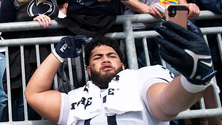 Penn State's Vega Ioane (right) takes a selfie following the Blue-White game at Beaver Stadium on Saturday, April 15, 2023, in State College.

230415 Hes Dr Bluewhite