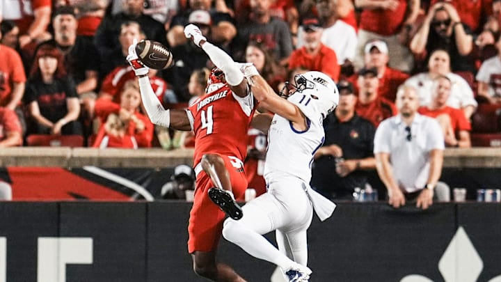 Louisville Cardinals defensive back Jabari Mack (4) intercepted a pass meant for James Madison Dukes wide receiver Nick DeGennaro (11) as the Cards defeated the James Madison University Dukes 28-14 Friday September 5, 2025 at L&N Federal Credit Union Stadium in Louisville, Kentucky.