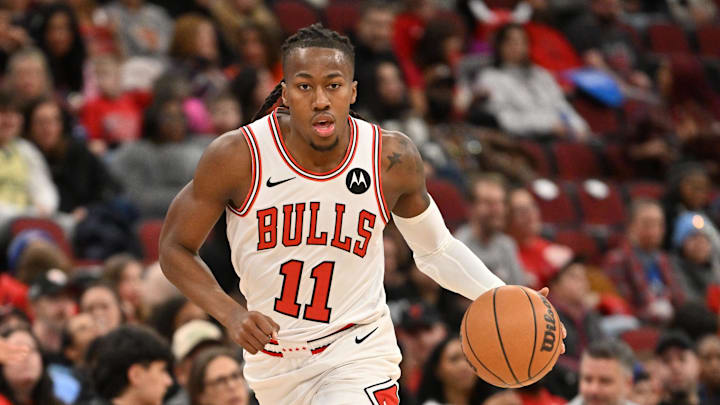 Jan 18, 2026; Chicago, Illinois, USA; Chicago Bulls guard Ayo Dosunmu (11) dribbles against the Brooklyn Nets during the first half at United Center. Mandatory Credit: Patrick Gorski-Imagn Images