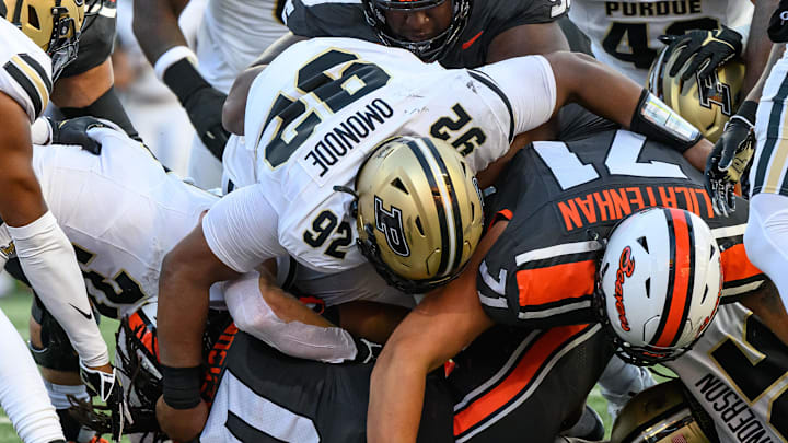 Oregon State running back Anthony Hankerson is stopped short of the goal line by Purdue defensive lineman Mo Omonode Oregon State running back Anthony Hankerson is stopped short of the goal line by Purdue defensive lineman Mo Omonode