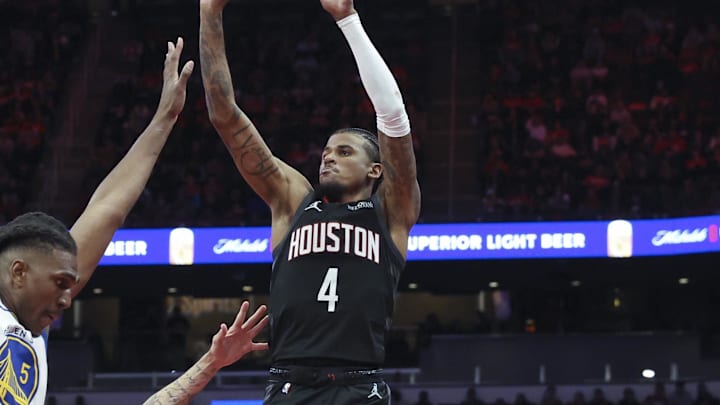 Dec 11, 2024; Houston, Texas, USA; Houston Rockets guard Jalen Green (4) shoots the ball as Golden State Warriors forward Lindy Waters III (43) and forward Kevon Looney (5) defend during the fourth quarter at Toyota Center. Mandatory Credit: Troy Taormina-Imagn Images Dec 11, 2024; Houston, Texas, USA; Houston Rockets guard Jalen Green (4) shoots the ball as Golden State Warriors forward Lindy Waters III (43) and forward Kevon Looney (5) defend during the fourth quarter at Toyota Center. Mandatory Credit: Troy Taormina-Imagn Images