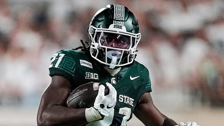 Michigan State running back Marvis Parrish (21) runs for s first down against Toledo safety Kaleb Hutchinson (17) during the first half at Spartan Stadium in East Lansing on Friday, Sept. 4, 2026. Michigan State running back Marvis Parrish (21) runs for s first down against Toledo safety Kaleb Hutchinson (17) during the first half at Spartan Stadium in East Lansing on Friday, Sept. 4, 2026.