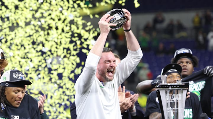 Oregon Ducks head coach Dan Lanning and the Oregon Ducks celebrate defeating the Penn State Nittany Lions to win the Big Ten Championship in the 2024 Big Ten Championship game at Lucas Oil Stadium.