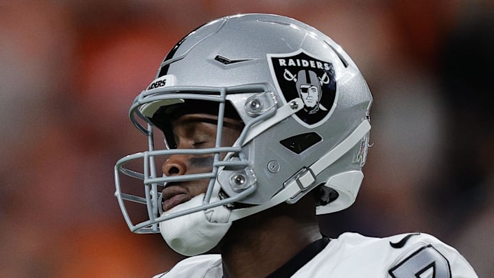 Nov 6, 2025; Denver, Colorado, USA; Las Vegas Raiders quarterback Geno Smith (7) reacts during the first half at Empower Field at Mile High. Mandatory Credit: Isaiah J. Downing-Imagn Images