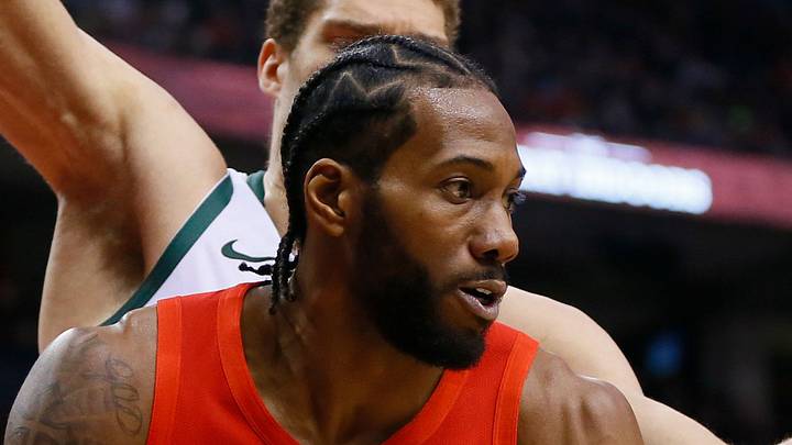 Raptors forward Kawhi Leonard ponders his next move as he's guarded by Bucks center Brook Lopez. Raptors forward Kawhi Leonard ponders his next move as he's guarded by Bucks center Brook Lopez.