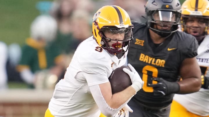 Sep 20, 2025; Waco, Texas, USA; Arizona State Sun Devils quarterback Sam Leavitt (10) breaks free of a tackle by Baylor Bears safety Devyn Bobby (3) during the first half at McLane Stadium. Mandatory Credit: Chris Jones-Imagn Images