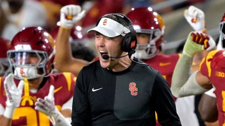 Oct 11, 2025; Los Angeles, California, USA; USC Trojans head coach Lincoln Riley celebrates after kicker Ryon Sayeri (48) hit a 54-yard field goal in the second half against the Michigan Wolverines at United Airlines Field at the Los Angeles Memorial Coliseum. Mandatory Credit: Jayne Kamin-Oncea-Imagn Images Oct 11, 2025; Los Angeles, California, USA; USC Trojans head coach Lincoln Riley celebrates after kicker Ryon Sayeri (48) hit a 54-yard field goal in the second half against the Michigan Wolverines at United Airlines Field at the Los Angeles Memorial Coliseum. Mandatory Credit: Jayne Kamin-Oncea-Imagn Images