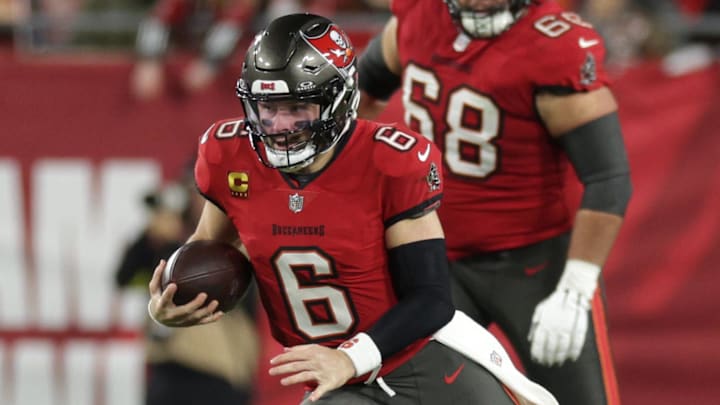 Tampa Bay Buccaneers quarterback Baker Mayfield scrambles during the second quarter of a NFC wild card playoff against the Washington Commanders. Tampa Bay Buccaneers quarterback Baker Mayfield scrambles during the second quarter of a NFC wild card playoff against the Washington Commanders.